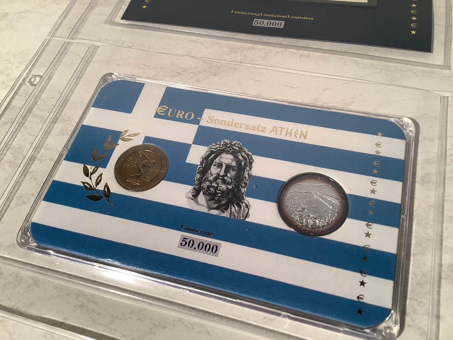 European €2 coin collection in a wooden box