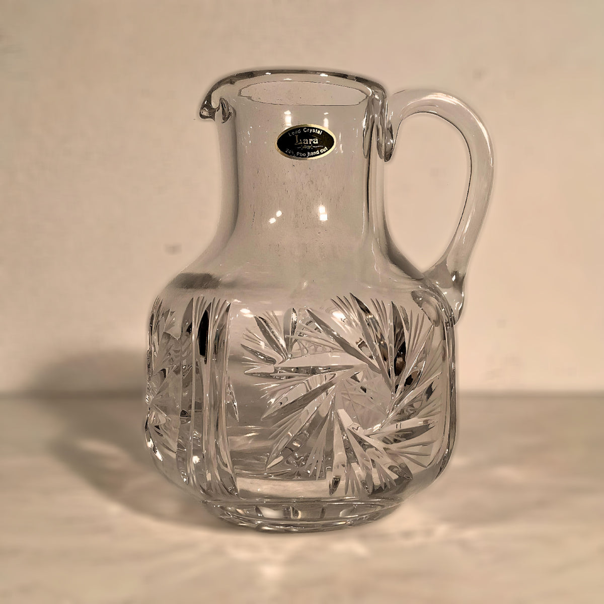 Lead crystal jug, star pattern, 21 cm high