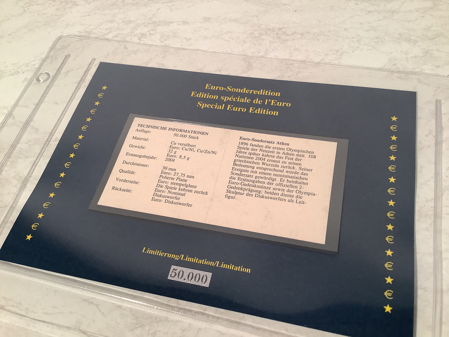 European €2 coin collection in a wooden box